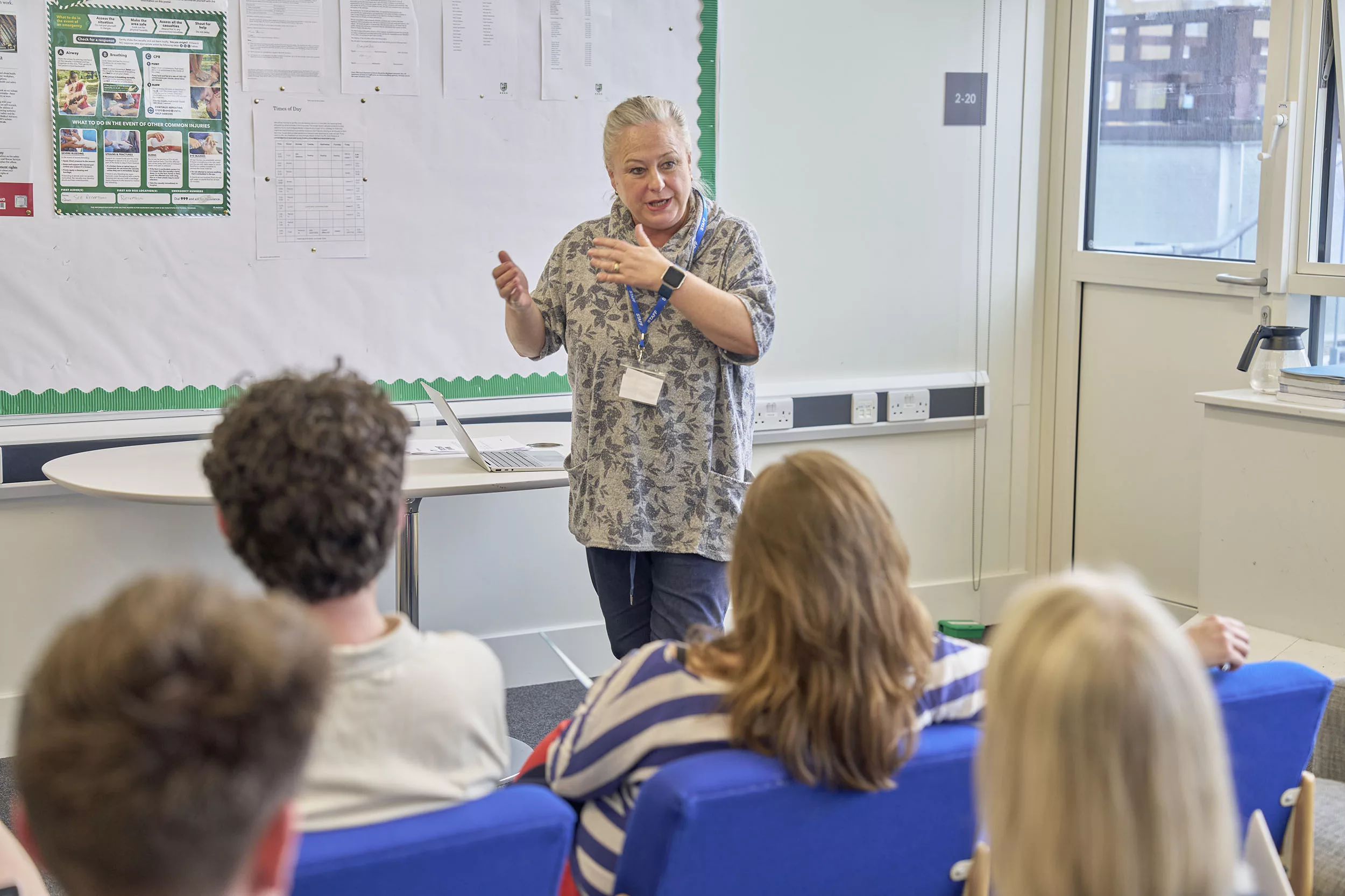 Social work trainer presenting to a room of professionals