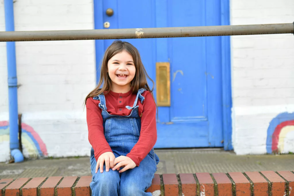 Girl sat on steps