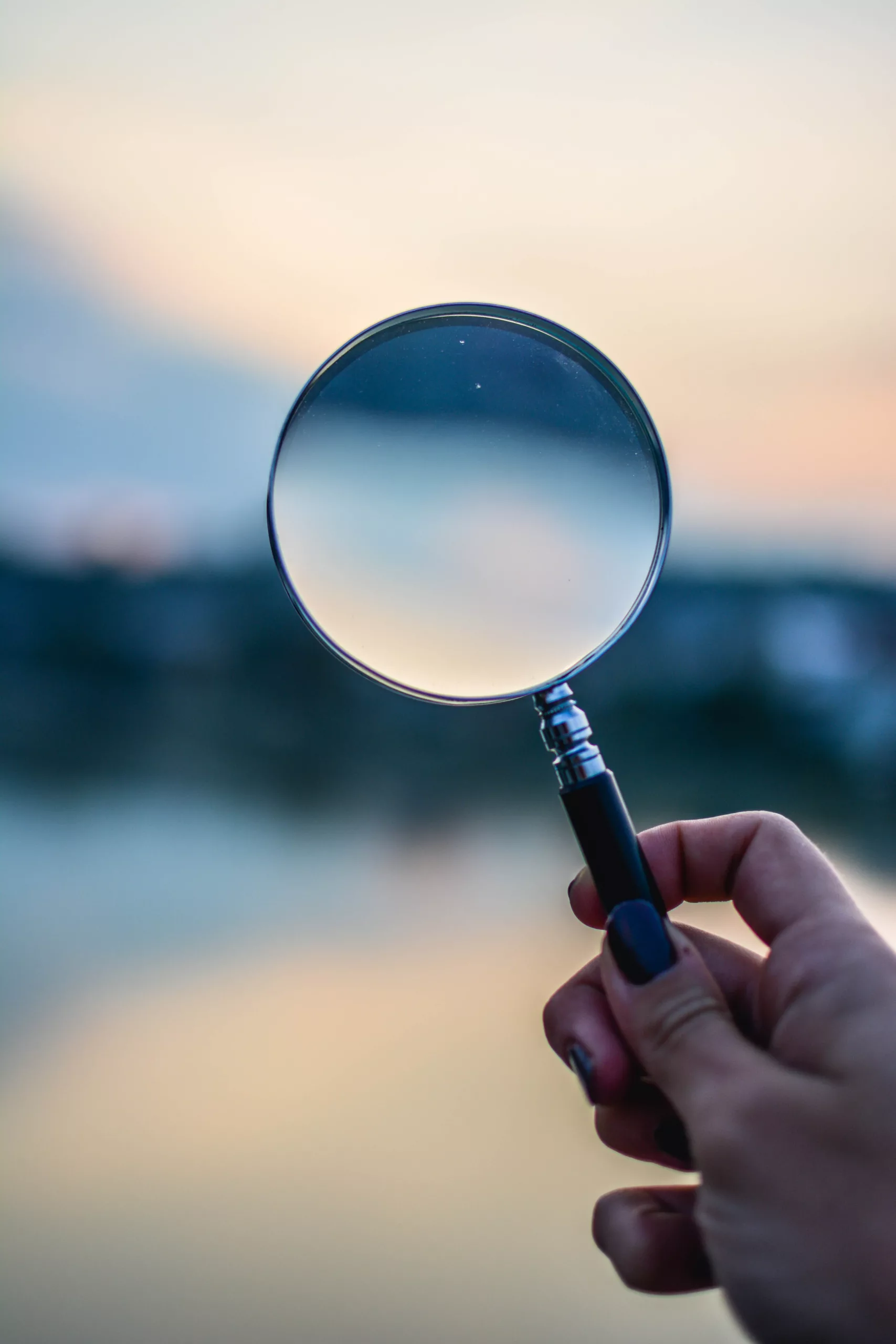 Magnifying glass looking out to a coastal landscape