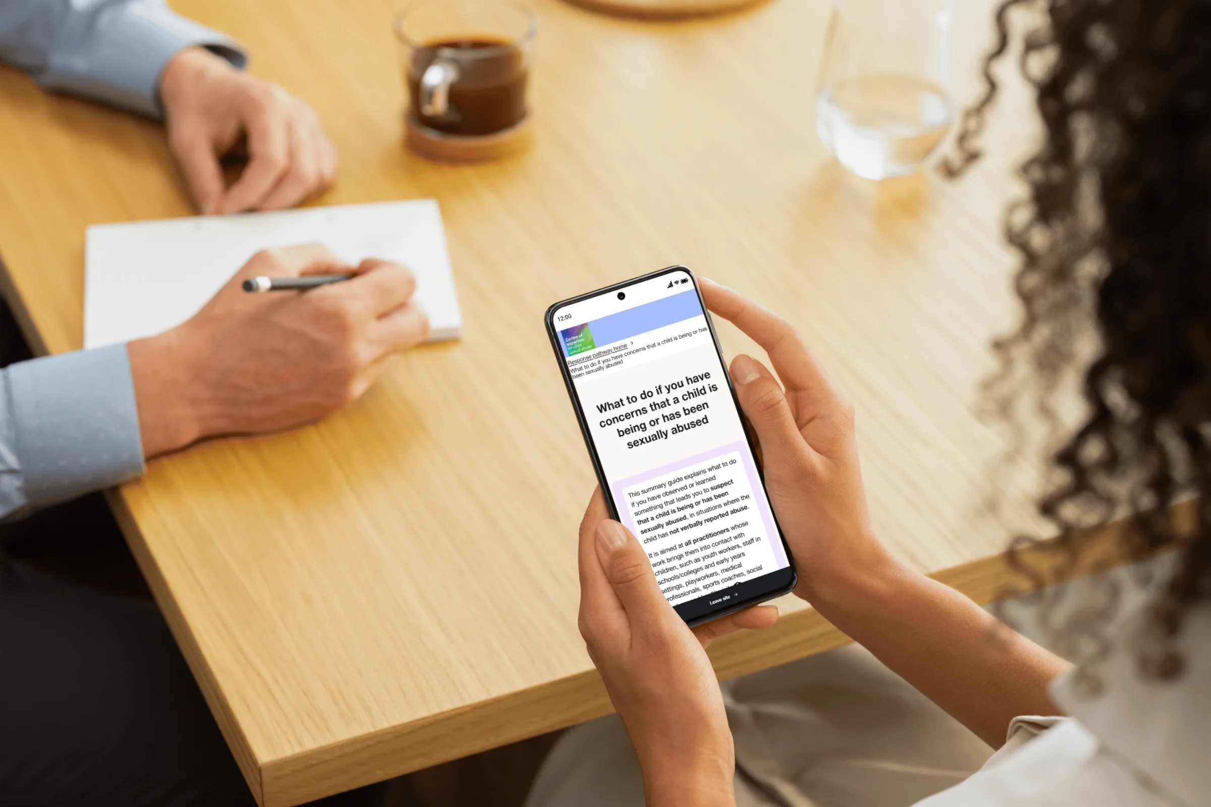 Person holding smartphone with page from the new Response Pathway on its screen
